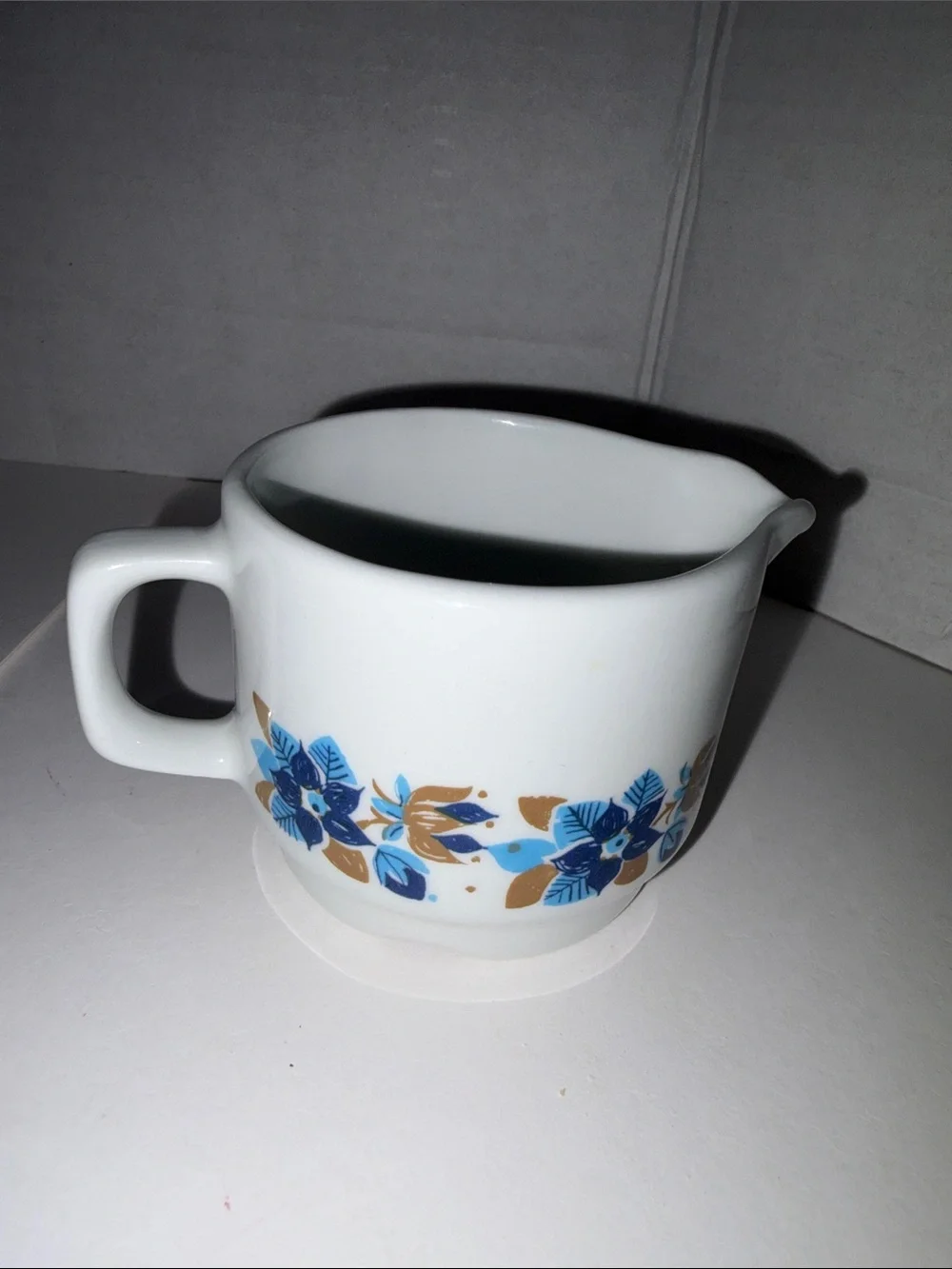 Vitro White Ceramic Creamer with Blue and Gold Floral Pattern